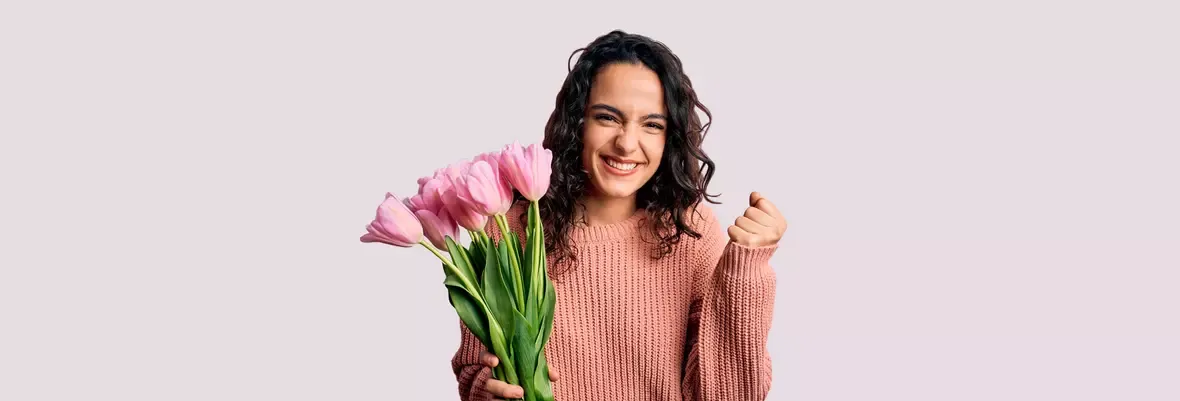 Happy woman with flowers in her hand